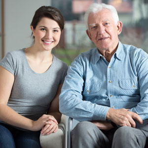 Elderly man with caregiver