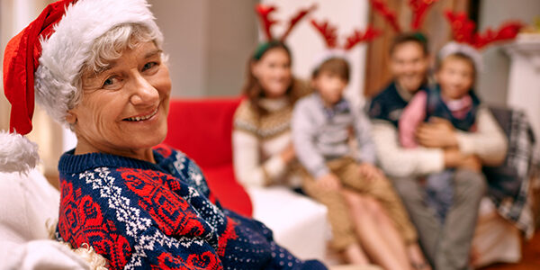 A happy grandmother with her family on Christmas Eve