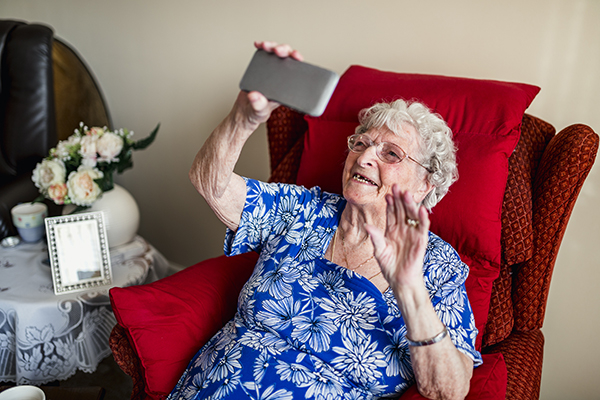 elderly woman is using a smartphone