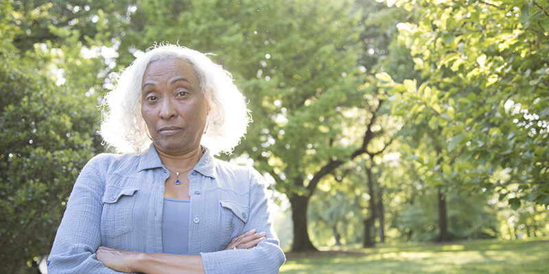 Annoyed Senior Woman Outside senior woman looks disparagingly at the camera