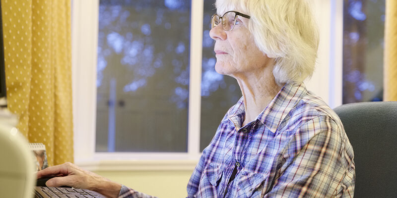 Senior old elderly person learning computer and online pension and banking internet skills protect against fraud Senior old elderly person learning computer and online pension and banking internet skills protect against fraud