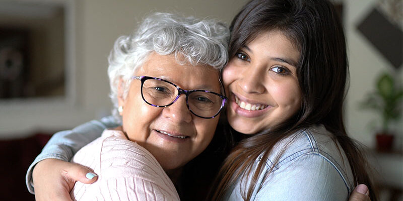 happy-senior-hugging-caregiver senior with dementia hugging caregiver