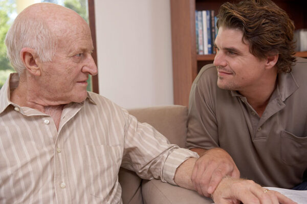 adult-son-talking-to-senior-father-with-dementia adult-son-talking-to-senior-father-with-dementia