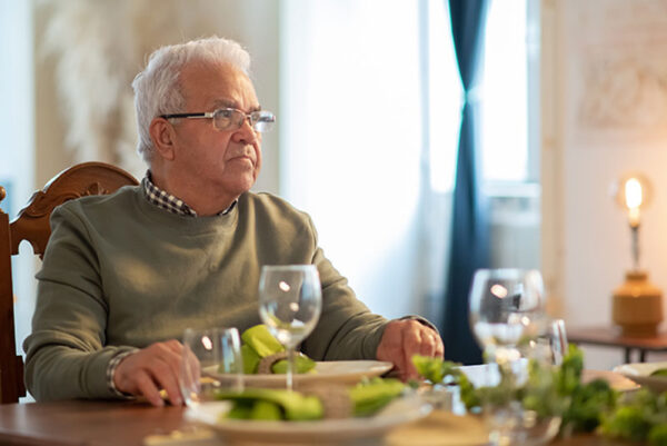 senior-man-sitting-at-dinner-table senior-man-sitting-at-dinner-table